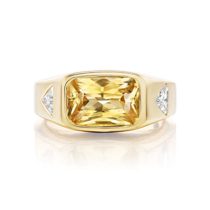 unheated yellow sapphire set in gold with trillion white diamonds
