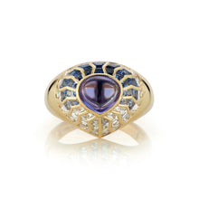 Load image into Gallery viewer, Close-up image of the Aphrodite Shield Ring with Blue Aura. The ring features intricate detailing and a vibrant blue aura gemstone at its center, reminiscent of the goddess Aphrodite. The shield-shaped design adds an elegant touch to the jewelry piece.