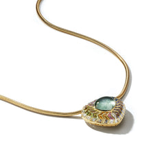 Load image into Gallery viewer, Experience the allure of our Wishing Well Shield Necklace in Feather. With a cabochon center and hand-cut baguettes set in gold, it radiates elegance from every angle. The side view reveals its intricate dimension, adding a touch of sophistication to any ensemble.