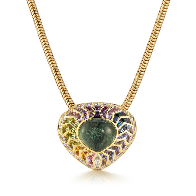 Immerse yourself in the celestial allure of our Wishing Well Shield Necklace in Feather. Featuring a captivating cabochon center enveloped by meticulously hand-cut baguettes, all set in radiant gold, this necklace exudes opulence and sophistication. With its intricate detailing and exquisite craftsmanship, it's a timeless piece that effortlessly elevates any look, adding a touch of allure and refinement to your ensemble.