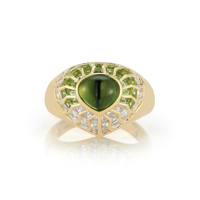Elevate your style with our Aphrodite Shield Ring featuring a radiant peridot cabochon. Encircled by hand-cut peridot and diamonds, it exudes timeless elegance. This captivating piece brings charm and sophistication to any look, making it a must-have addition to your collection.