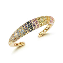 Load image into Gallery viewer, Behold the exquisite Aurora cuff, a testament to elegance and sophistication. This stunning piece features a mesmerizing array of diamonds and colored stones, meticulously set in both baguette and round cuts. Inside the gallery, the intricate flower of life pattern adds a touch of mystique and symbolism. Crafted in radiant gold, this cuff exudes timeless beauty and opulence.